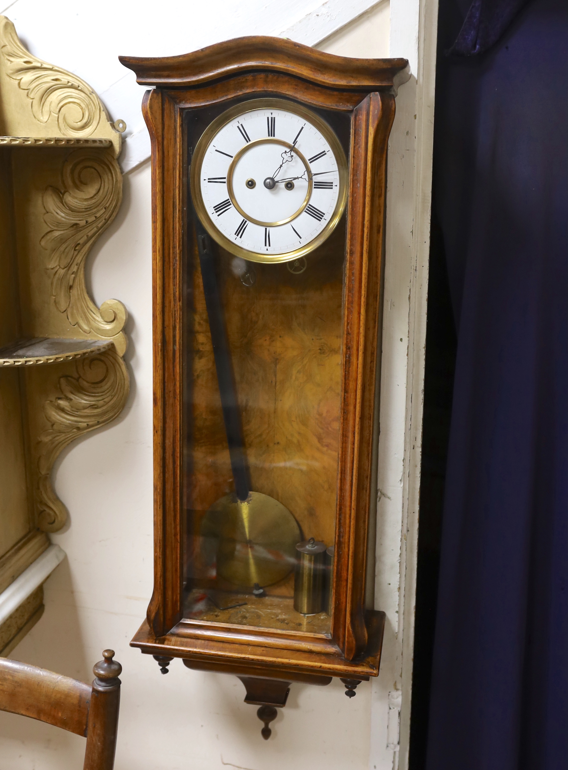 A 19th century Viennese regulator with key and weights, striking on a coiled gong, 103cm high